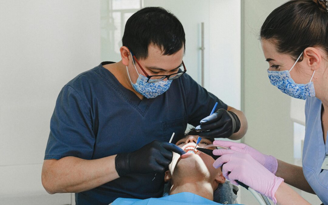 A two dentist checking the patient mouth